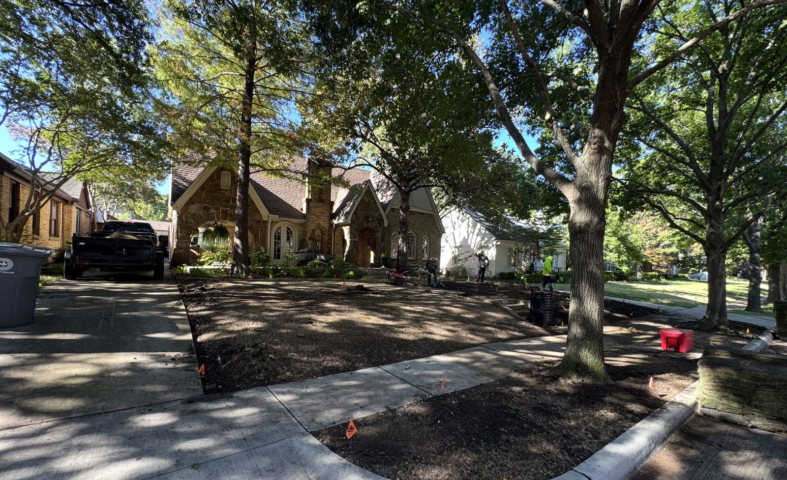 A Dallas front yard prepped with bare soil before sod installation